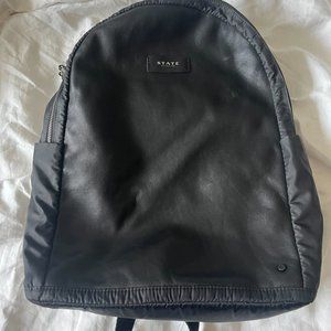 State backpack in black coated material great condition!